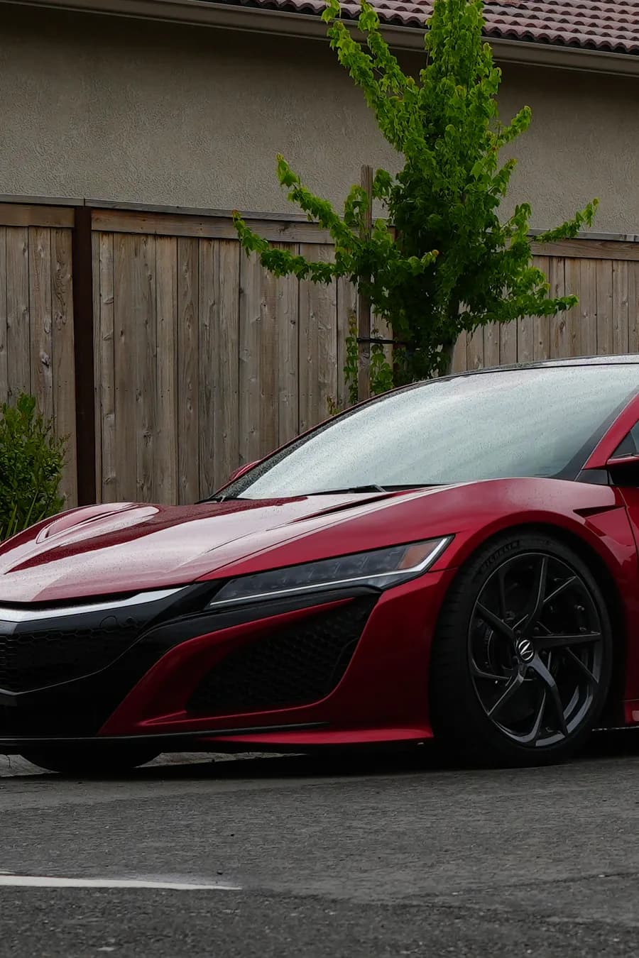 John's red 2017 Acura NSX parked on the street